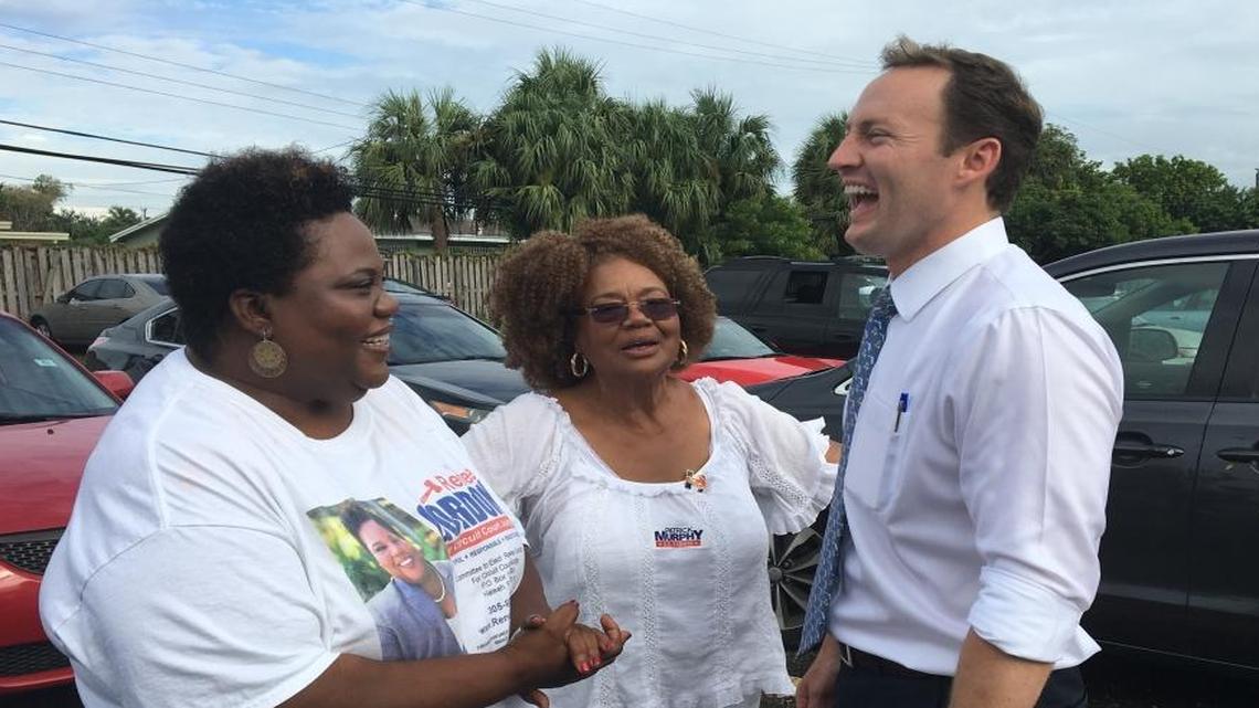 U.S. Rep. Patrick Murphy, Democratic candidate for U.S. Senate, laughs with voters at the Miami Gardens Church of Christ on Tuesday, Aug. 30, 2016.