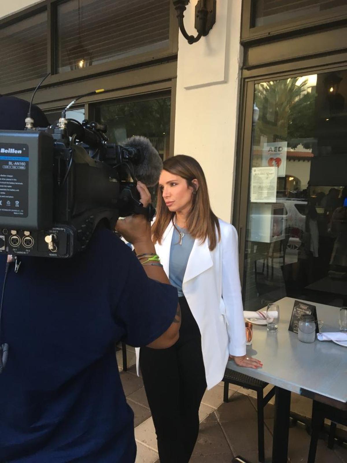 Ileana Garcia, founder of Latinas for Trump, conducts a TV interview in Coral Gables on Wednesday.