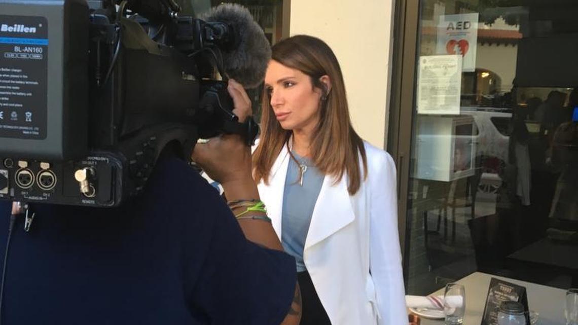Ileana Garcia, founder of Latinas for Trump, conducts a TV interview in Coral Gables in 2016.