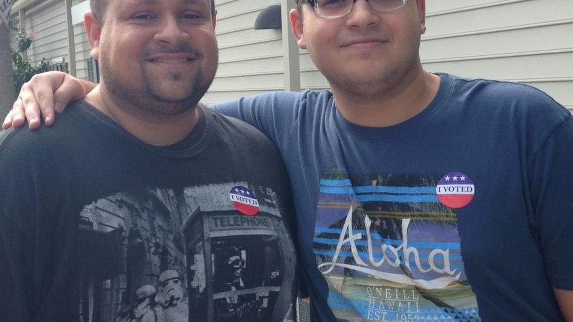 Luis Mateo, 40, of Kissimmee and his son, Izaiah, 18, are Puerto Rican voters who support Clinton.