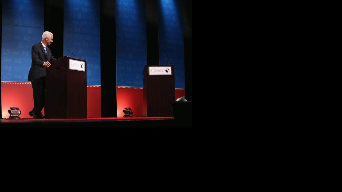 
Former Florida Gov. Charlie Crist waits next to an empty podium for Republican Florida Governor Rick Scott, who at first refused to participate in a gubernatorial debate due to an Crist’s use of an electric fan.
