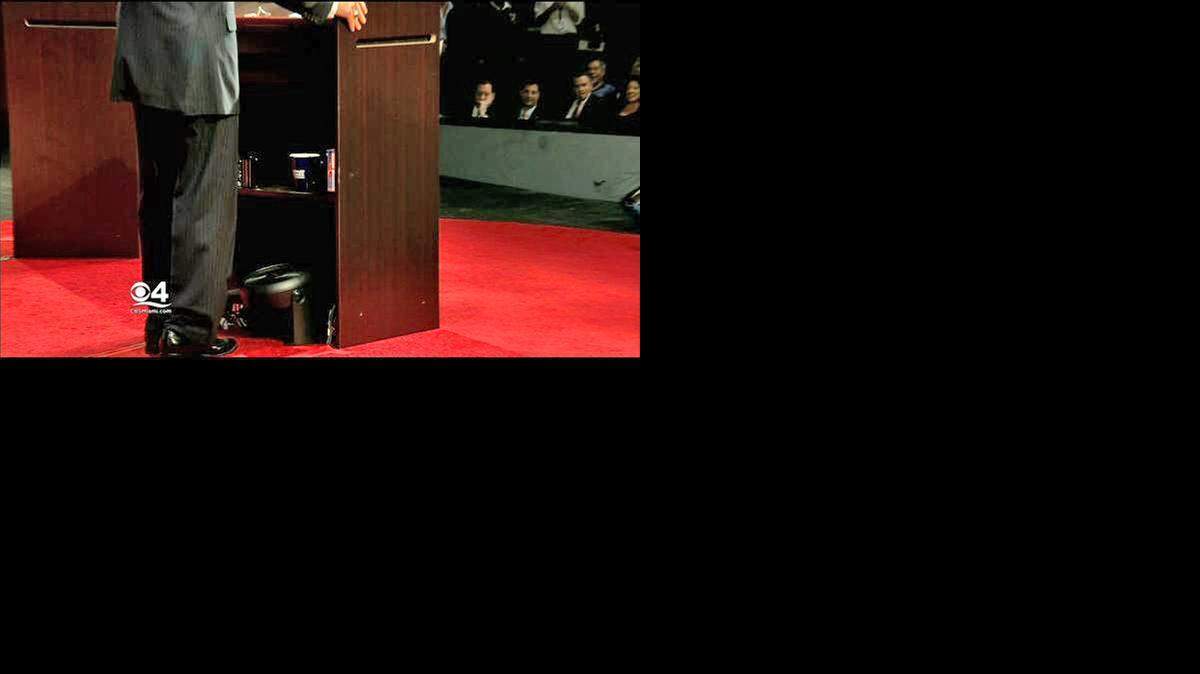 
Charlie Crist uses an electric fan under his lectern during a gubernatorial debate against Gov. Rick Scott.
