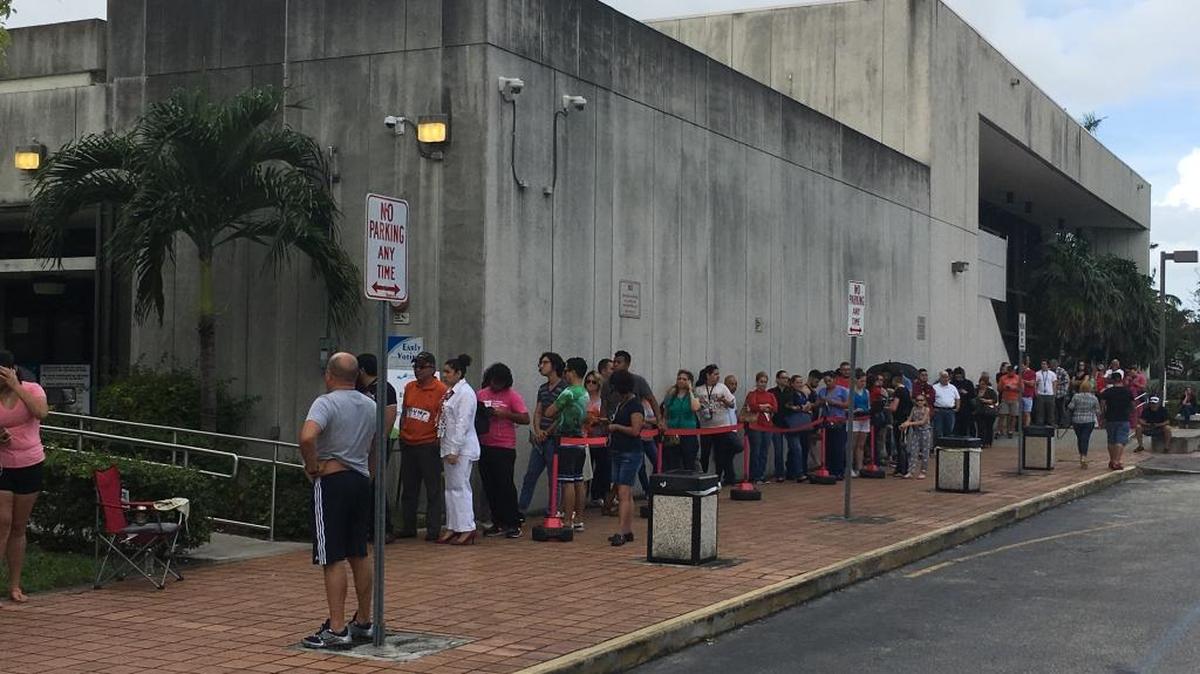 A line of voters snaked around the West Dade Regional Library on Sunday afternoon. The wait to vote was about an hour long.