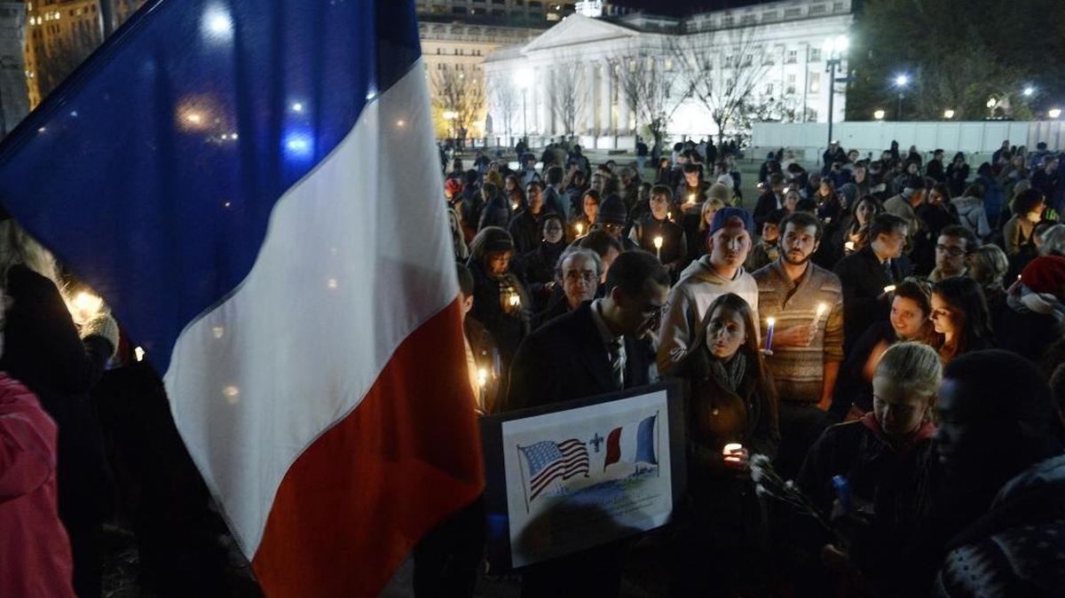 A crowd gathers for a vigil in honor of the victims of terrorist attacks in Paris at Lafayette Square outside the White House on Saturday. People gathered in cities around the world to show support for Paris following the coordinated assault Friday that left at least 129 people killed.