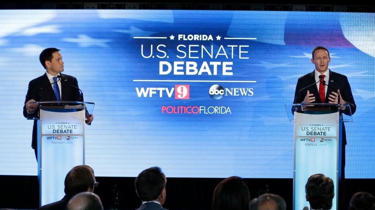 Republican Sen. Marco Rubio, left, listens as Democratic Rep. Patrick Murphy speaks during their first U.S. Senate debate on Oct. 17 at the University of Central Florida in Orlando.