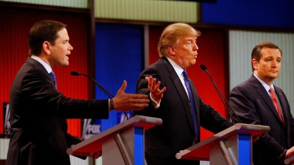 Republican presidential candidates, Sen. Marco Rubio, R-Fla., and businessman Donald Trump argue a point as Sen. Ted Cruz, R-Texas, listens during a Republican presidential primary debate at Fox Theatre, Thursday, March 3, 2016, in Detroit.