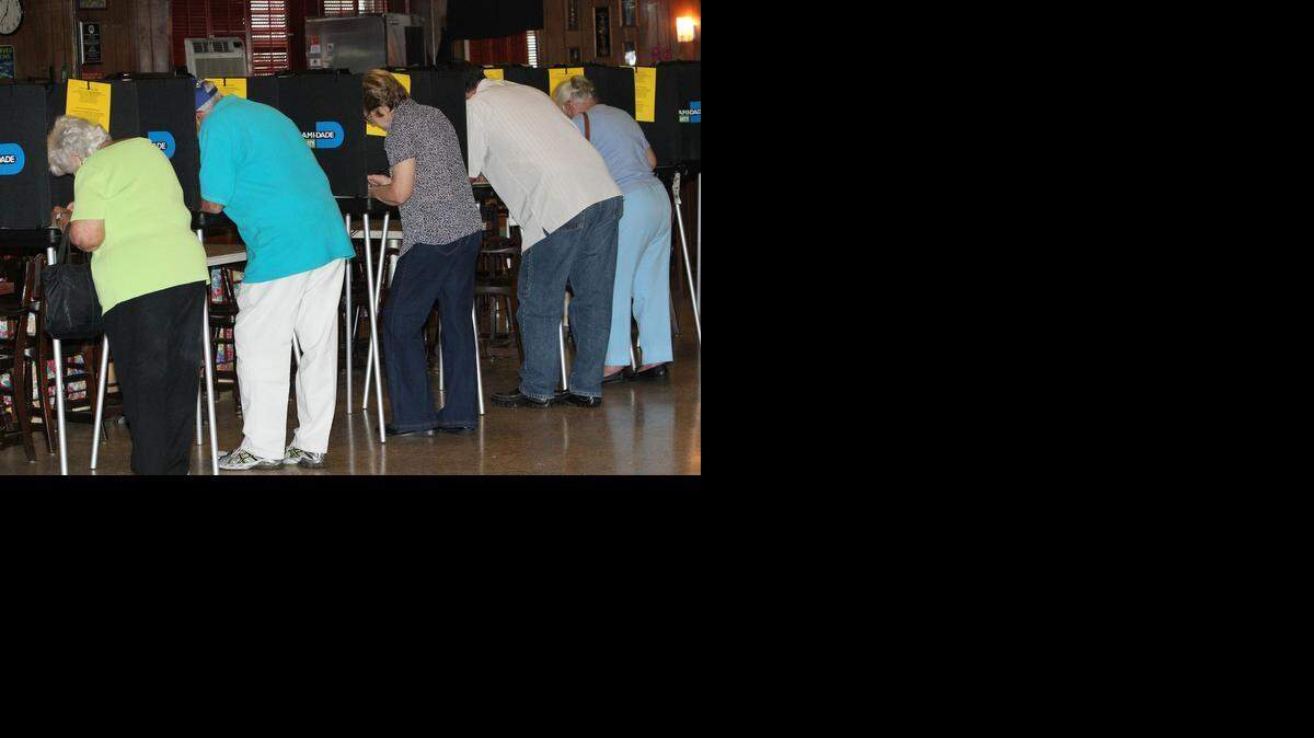 
People vote during a primary election at the Polish American Club of Miami.
