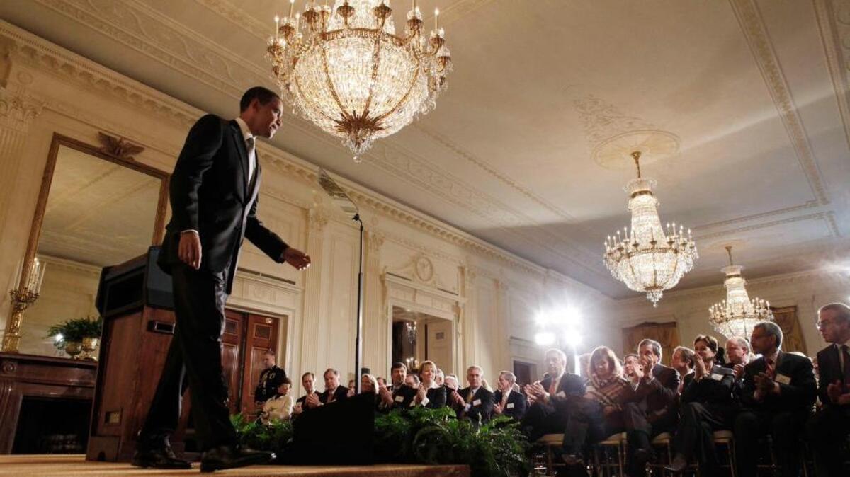 In this Feb. 13, 2009, file photo, President Barack Obama steps off the stage after addressing business leaders about the economy in the East Room of the White House in Washington.