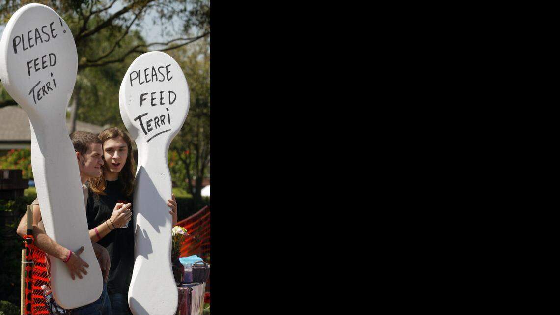 
Jordan Hall, left, and Sterling Sevcov hold huge styrofoam spoons as they protest in front of Terri Schiavo's hospice Sunday, March 20, 2005. They came from Texas to be here. Protestors gathered outside the Woodside Hospice Sunday, March 20, 2005 to pray and plead for brain-damaged Terri Schiavo, a 41-year-old woman incapacitated for 15 years, whose feeding tube was disconnected Friday by court order.
