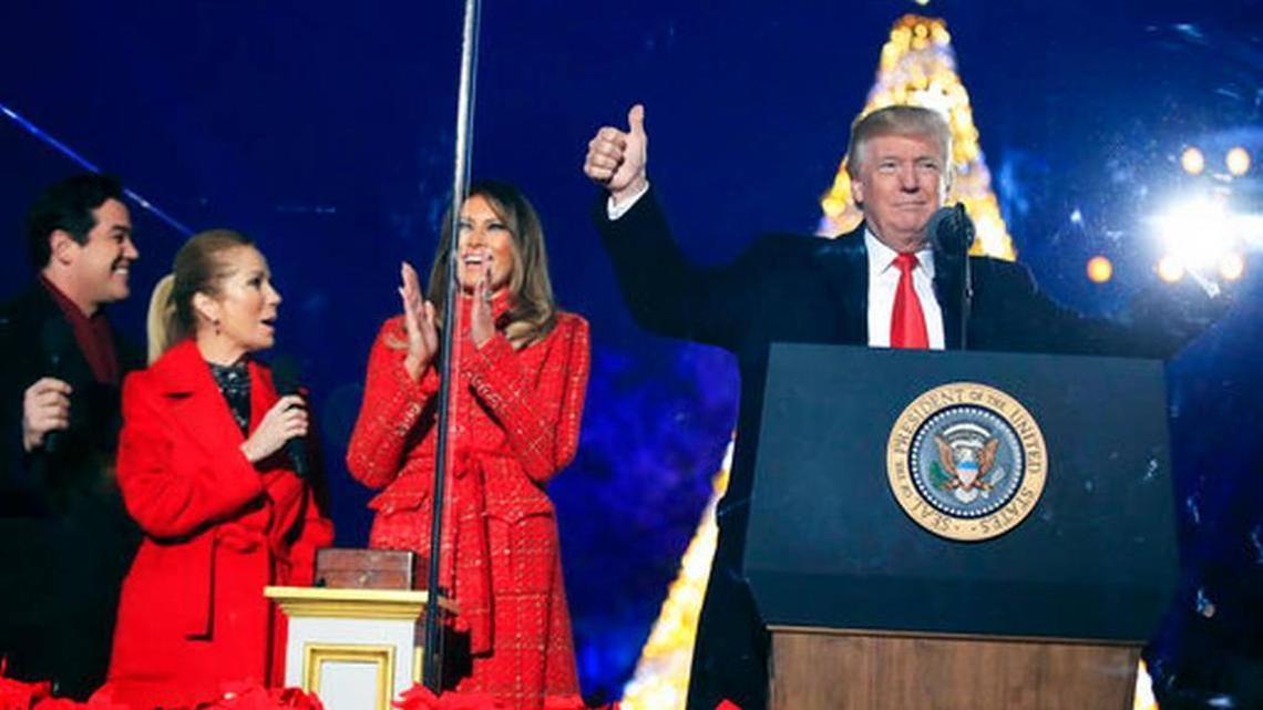 President Donald Trump and first lady Melania Trump, cheer after lighting the 2017 National Christmas Tree during the National Christmas Tree lighting ceremony at the Ellipse near the White House in Washington, Thursday, Nov. 30, 2017.