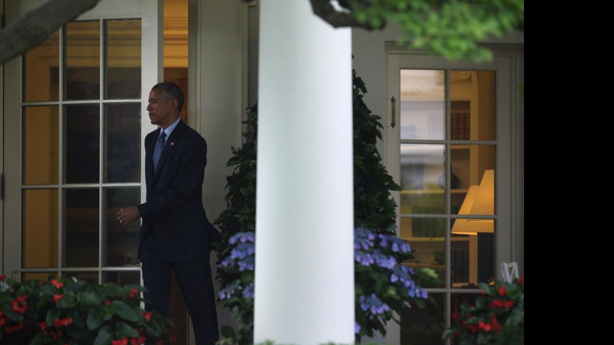 
FLORIDA FUNDRAISING: President Barack Obama comes out from the Oval Office prior to his departure from the White House on Wednesday. He traveled to Miami to attend two Democratic National Committee fundraisers before visiting the National Hurricane Center on Thursday
