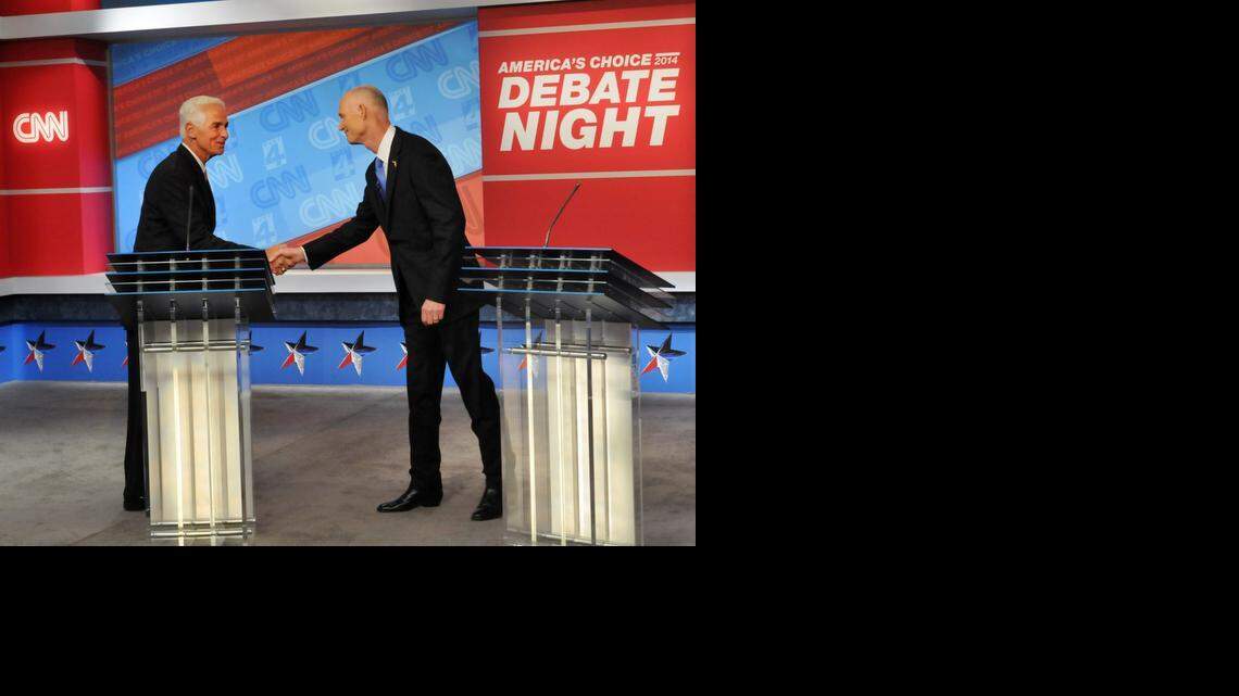 
Democratic candidate Charlie Crist, left, and Republican Gov. Rick Scott shake hands before their live television debate, Tuesday, Oct. 21, 2014 hosted by WJXT-TV and CNN at the Channel 4 studios in Jacksonville.

