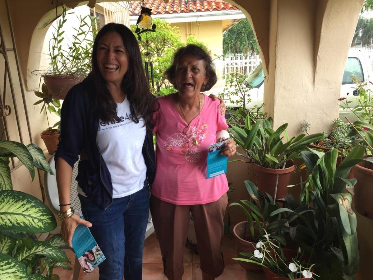 Denise Galvez Turros, left, laughs with Maria Guadarrama during an afternoon of campaigning.