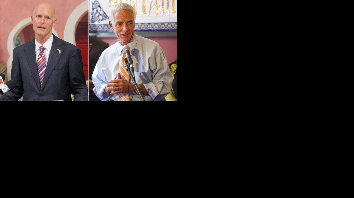 
TIGHT CONTEST: The race between Republican Gov. Rick Scott, left, and Republican-turned-Democrat former Gov. Charlie Crist is too close to call, according to the Quinnipiac University poll released Wednesday.
