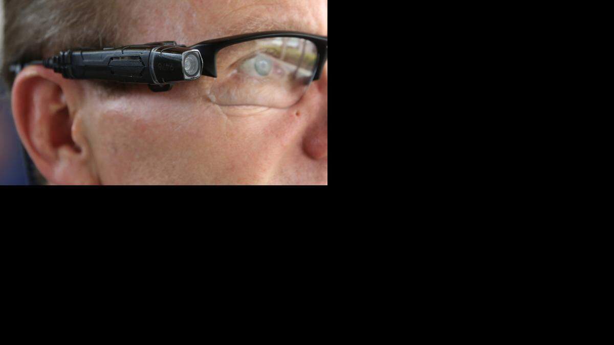 
Steve Tuttle, vice president of communications for Taser International, demonstrates one of the company's body cameras that can be attached to glasses.
