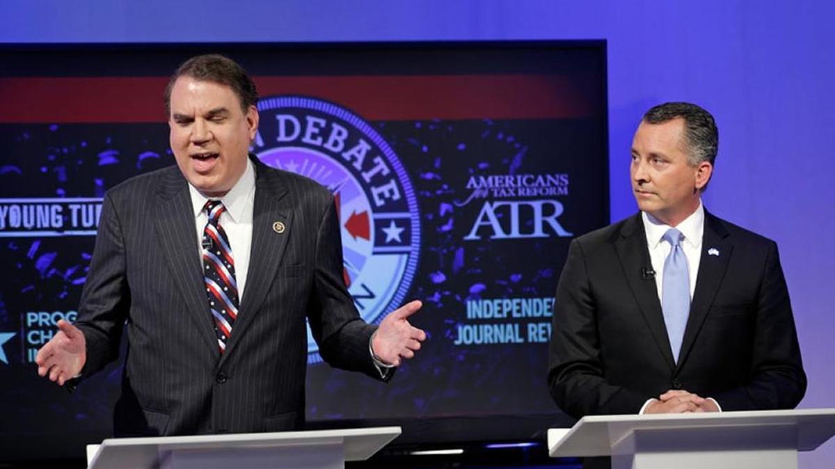 U.S. Rep. Alan Grayson, D-Fla., left, and U.S. Rep. David Jolly, R-Fla., take part in an open debate for the U.S. Senate on Monday in Orlando.