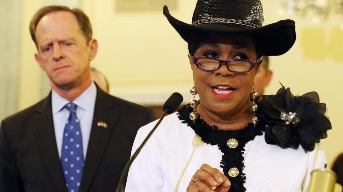 Rep. Frederica Wilson (D-FL) (R) speaks about protecting students from sexual predators while Sen. Pat Toomey (R-PA) (L) listens during a news conference on Capitol Hill, September 9, 2014 in Washington, DC. Sen Toomey and other members of Congress called on the U.S. Senate to pass H.R.2083, the Protecting Students from Sexual and Violent Predators Act of 2013.