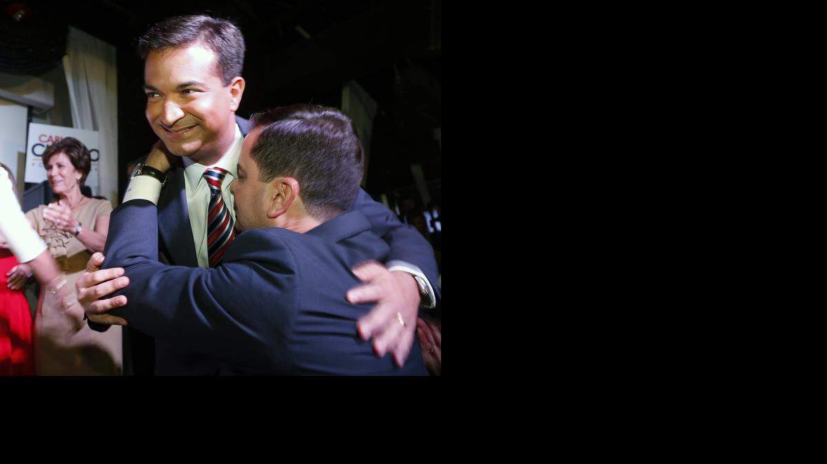 
Carlos Curbelo embraces a supporter after announcing his victory over Miami Rep. Joe Garcia.
