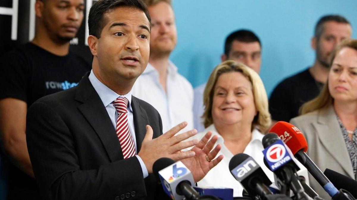 Miami Republican Reps. Carlos Curbelo and Ileana Ros-Lehtinen speak in downtown Miami in February.