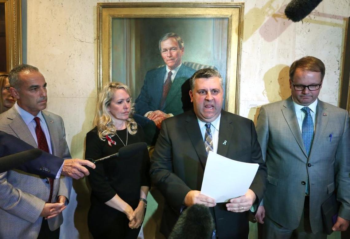 Left to right: Marjory Stoneman Douglas parents Andrew Pollack, Gena Hoyer, Tony Montalto and Ryan Petty meet with reporters after the bill signing at the Capitol, Friday, March 9, 2018. Tony Montalto read a statement on behalf of the parents.
