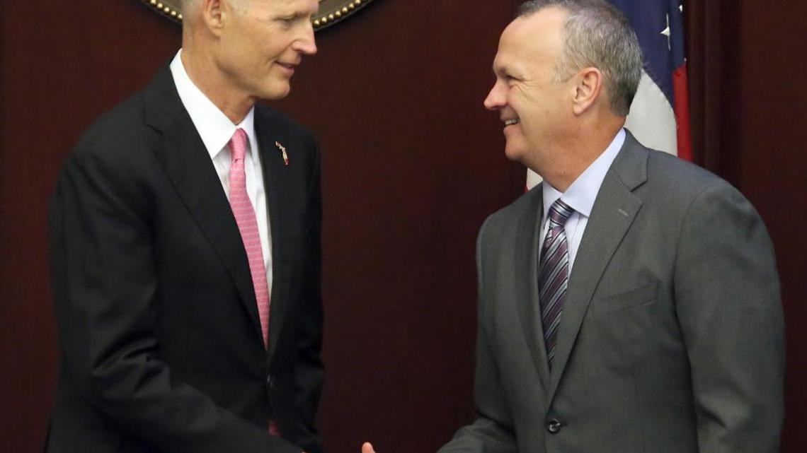 Gov. Rick Scott, left, shakes hands with House Speaker Richard Corcoran, R-Land O’Lakes, as the House takes up legislation to repair the Herbert Hoover dike around Lake Okeechobee during session, Friday, June 9, 2017, in Tallahassee.