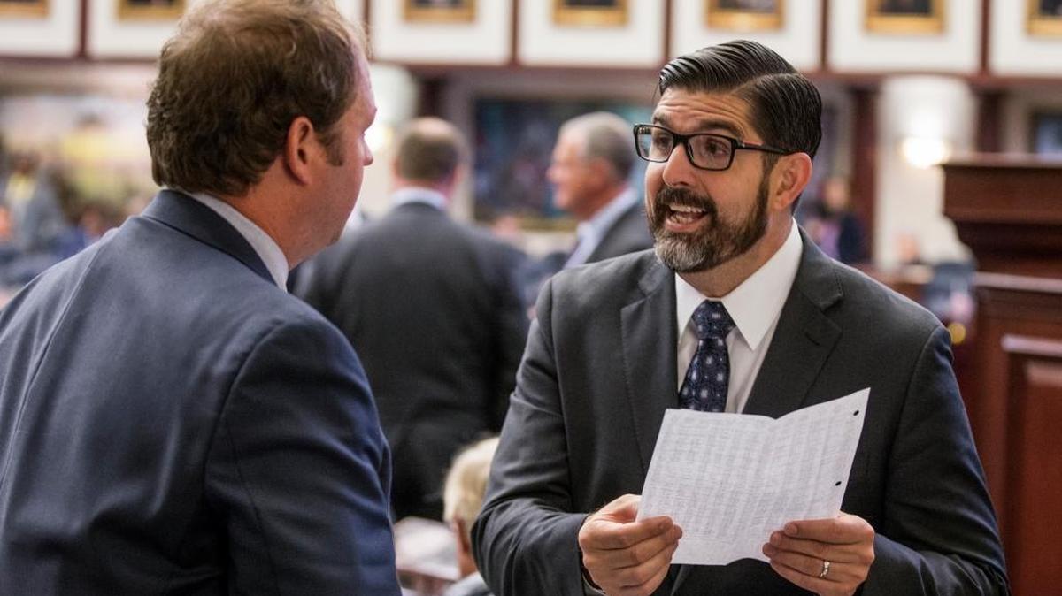 House pre-K-12 education budget chairman Manny Diaz, R-Hialeah, right, talks with Rep. Jayer Williamson, R-Pace, on the House floor during a special session of the Florida Legislature Thursday June 8, 2017, at the Capitol in Tallahassee, Fla.