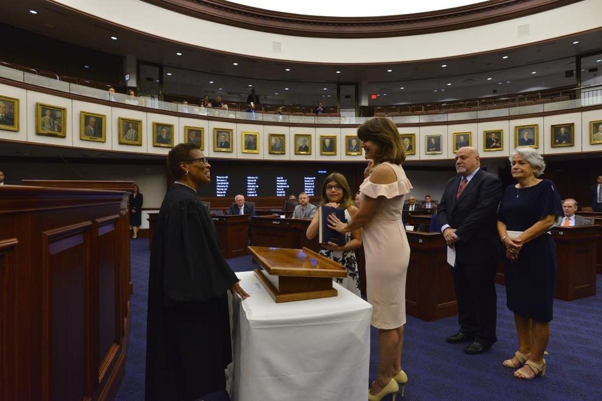 State Sen. Annette Taddeo, D-Miami, center, is sworn in to office by Florida Supreme Court Justice Peggy Quince on Oct. 10, 2017. She was joined at her swearing-in ceremony by her 11-year-old daughter Sofia Taddeo-Goldstein, her husband Eric Goldstein and her mother Elizabeth Taddeo.