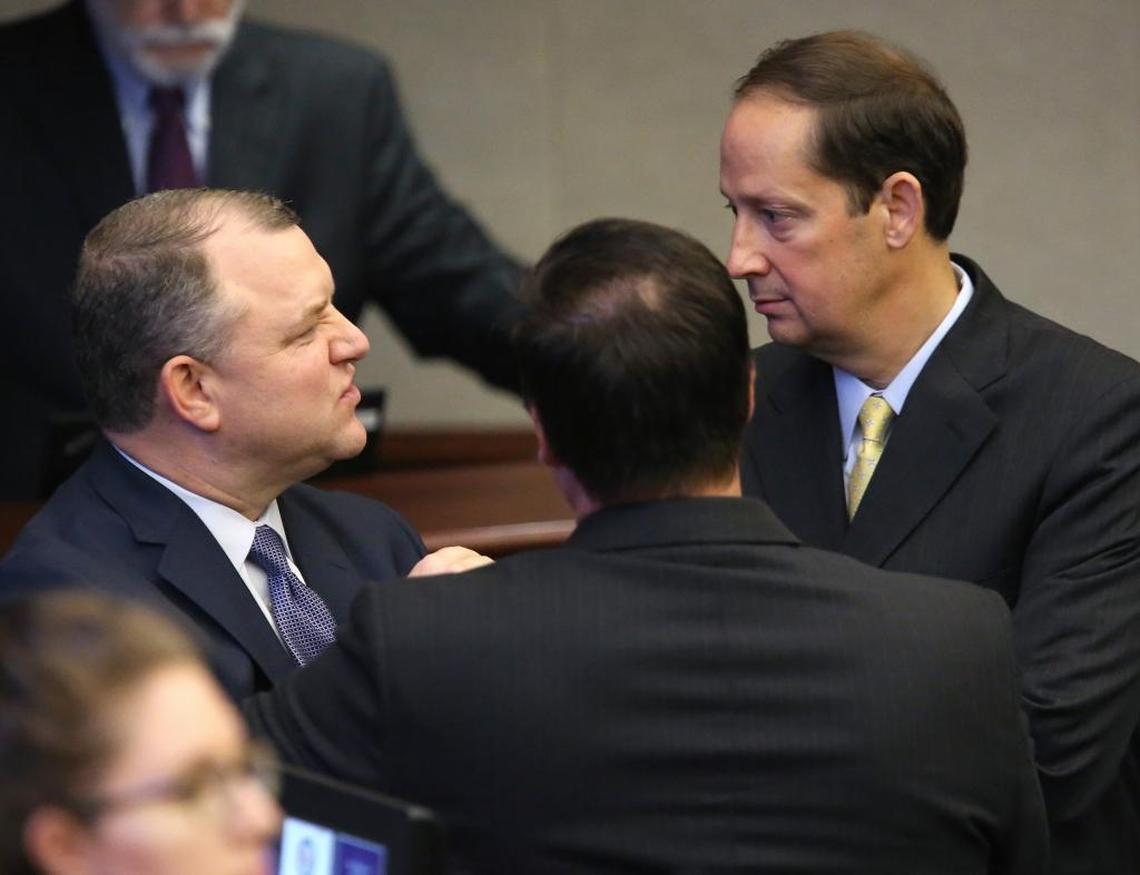 Sen. Rob Bradley, R-Fleming Island, left, confers with Sen. Aaron Bean, R-Fernandina Beach, center, and Senate President Joe Negron, R-Stuart, during session, Friday, June 9, 2017, in Tallahassee, Fla.