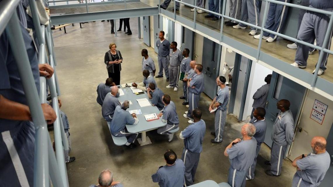 Florida Department of Corrections Secretary Julie Jones visits with Wakulla Correctional Institution inmates Tuesday morning, March 8, 2016 during a visit to the Betterment Dorm at the Crawfordville facility.