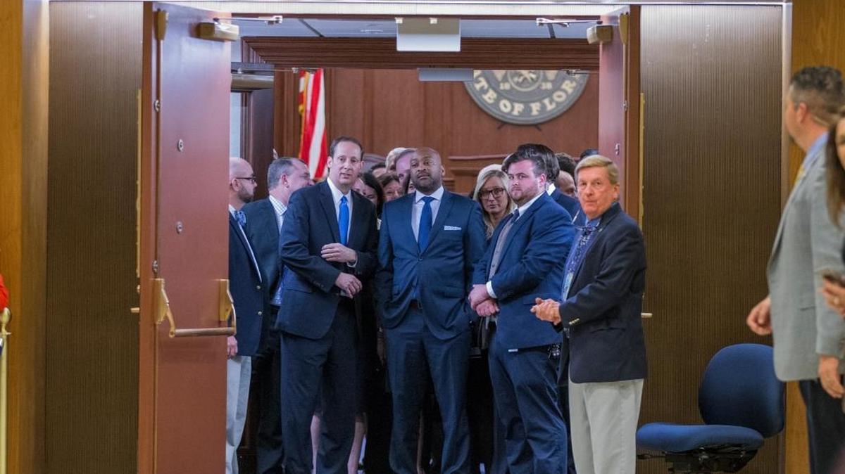 Florida Senate President Joe Negron, R-Stuart, left, and Senate members wait to meet members of the House of Representatives in the rotunda between the two chambers at the close of the 2017 legislative session Monday night, May 8, 2017, at the Florida Capitol in Tallahassee, Florida.