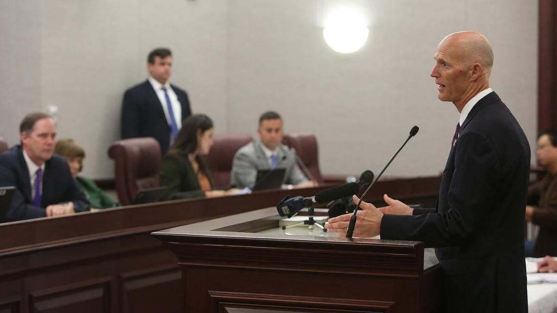 Gov. Rick Scott, right, promotes his tax-cut plan in an appearance before members of the Florida Senate Finance and Tax Committee, Jan. 11, at the Capitol.