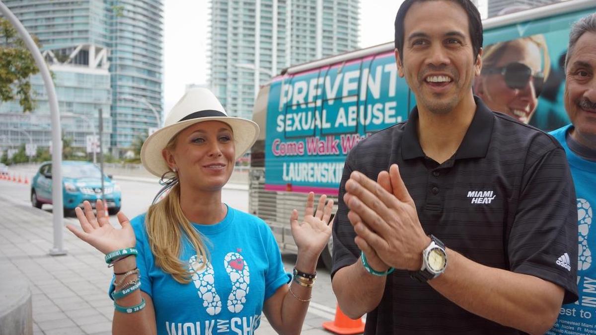 Lauren Book, left, with Miami Heat Coach Erik Spoelstra, was leading a 1,500-mile walk through Florida in an annual awareness campaign with her Lauren's Kids organization when this photo was taken in 2013. Now she’s running for a seat in the Florida Senate.