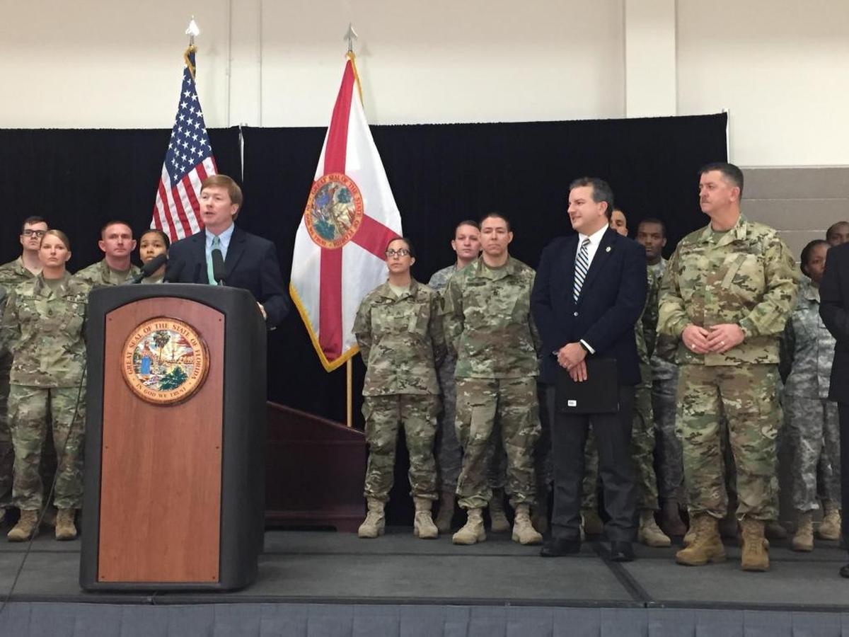 Agriculture Commissioner Adam Putnam, a Republican candidate for governor, speaks at a press conference Tuesday at the Florida National Guard Armory in Tallahassee.