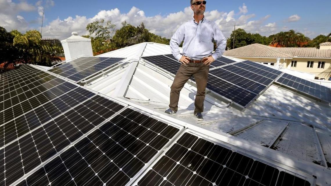 Surfside Mayor Daniel Dietch on the roof of his home powered by solar panels on Thursday, November 12, 2015.