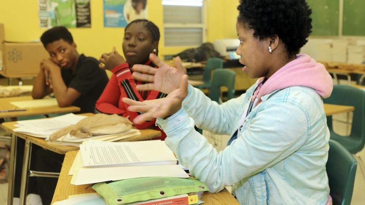 Booker T. Washington High School junior Gabriella Duroseau, 17, right, asks a procedural question on Jan. 7, 2016 during the school’s first debate club meeting of the new year.