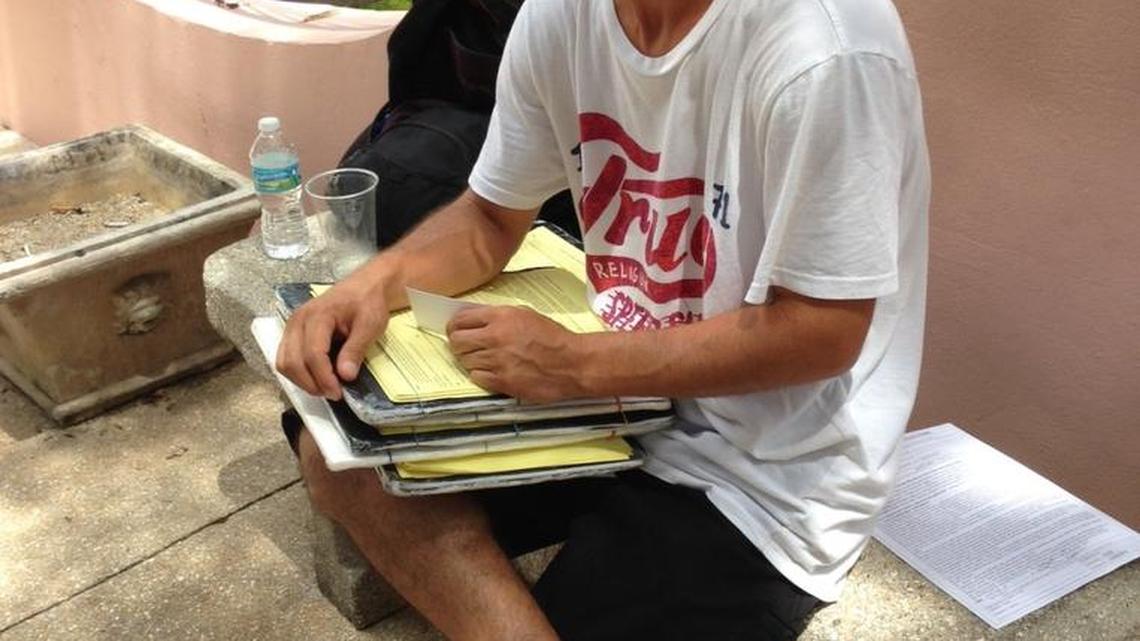 Aaron Wood, 41, of Denver, gathers voters’ signatures in St. Augustine in early October for ballot initiatives on pot and solar energy.