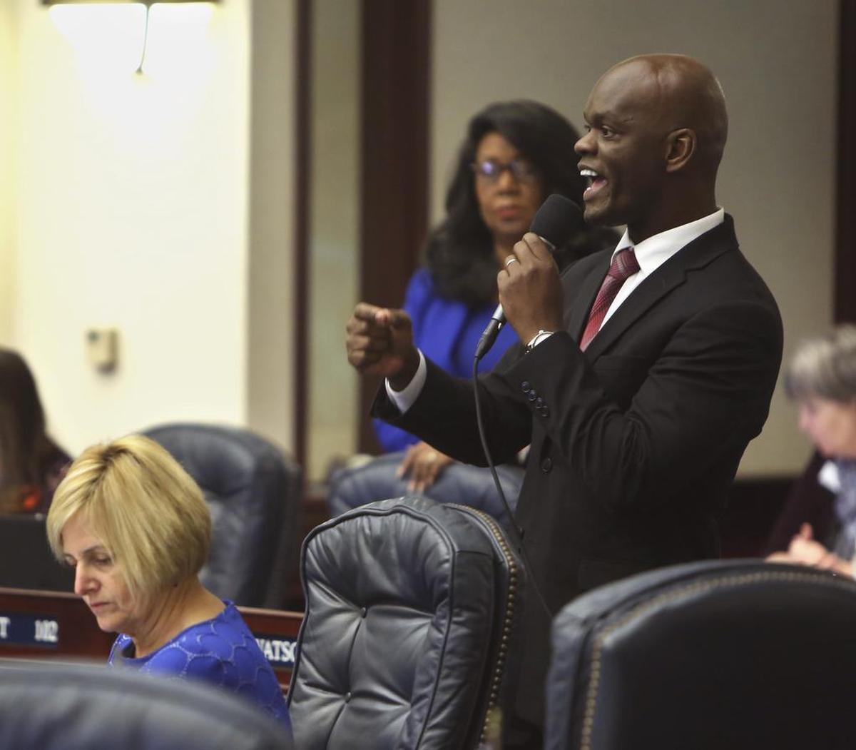 Rep. Kionne McGhee, D-Miami, right, questions Rep. Jose Oliva, R-Miami Lakes, on a gun and school safety bill on the floor of the House at the Capitol in Tallahassee, Tuesday, March 6, 2018.