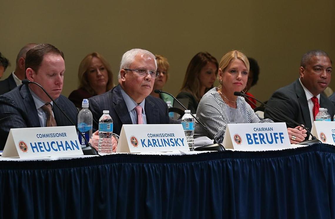 Chairman Carlos Beruff, center, is flanked by Commissioner Fred Karlinsky and Attorney General Pam Bondi as members of the Constitutional Revision Commission listen to residents during a town hall meeting with at Florida International University in Miami, April 6, 2017.