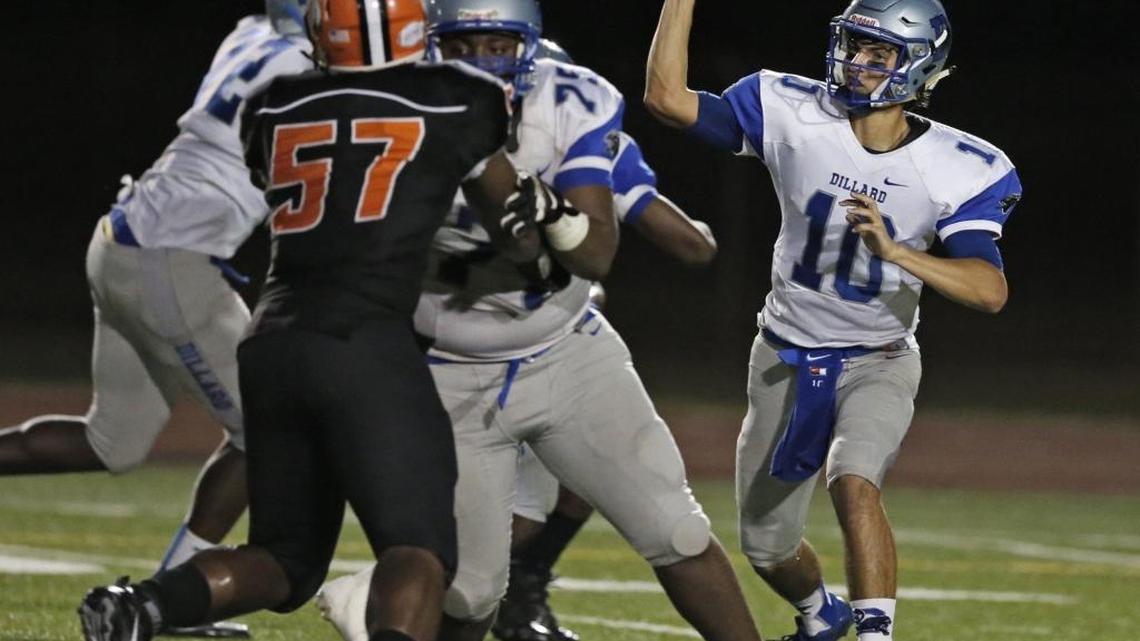 Dillard's quarterback Anthony Hasan sets up to pass in the second quarter during high school football playoff game between Dillard High and Carol City High School at Traz Powell Stadium on Nov. 13, 2015