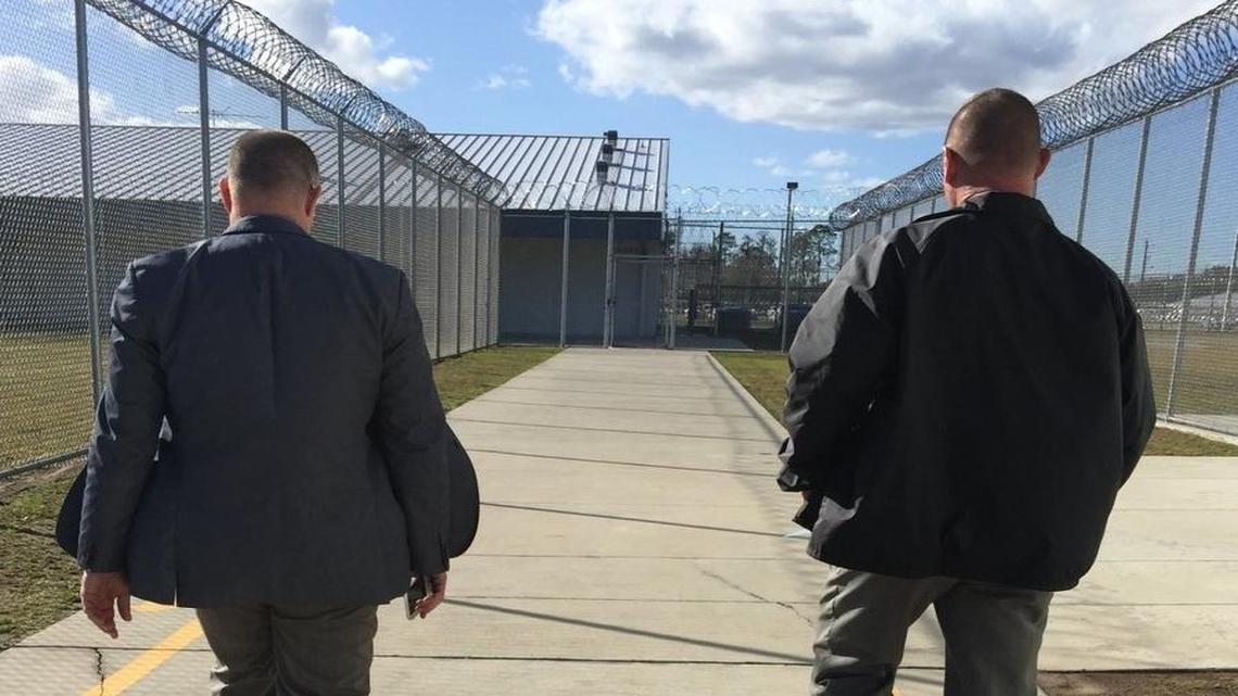 State Rep. David Richardson, D-Miami Beach, left, walks with the former warden at Suwannee Correctional, Thomas Reid. This was one of Richardson’s many unannounced inspections of a Florida prison.