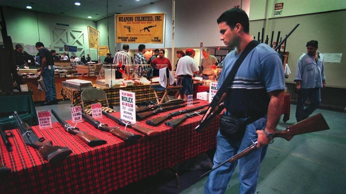 David Thompson attends the Coconut Grove Gun Show in Miami in 1999 file photo. Some legislators want to rewrite Florida’s concealed weapons law so that people can get gun licenses even when criminal background checks are incomplete.