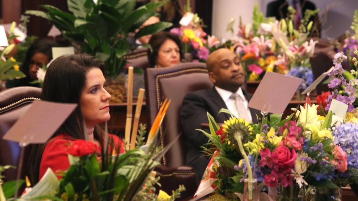 Senators Anitere Flores, left, and Oscar Braynon, listen to Senate President Joe Negron talk about sexual harassment in his opening remarks to start the 2018 legislative session.