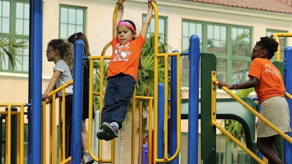 Kristen Bachmann, 6, swings on the equipment during recess at North Beach Elementary’s Jennifer Beth Turken Playground on Friday, March 18, 2016 at the Miami Beach school. Kristen and fellow second-graders in Jessica Jiminez’s class have two 20-minute recesses per week and a 30-minute PE class Monday through Friday. The school is at 4100 Prairie Ave.