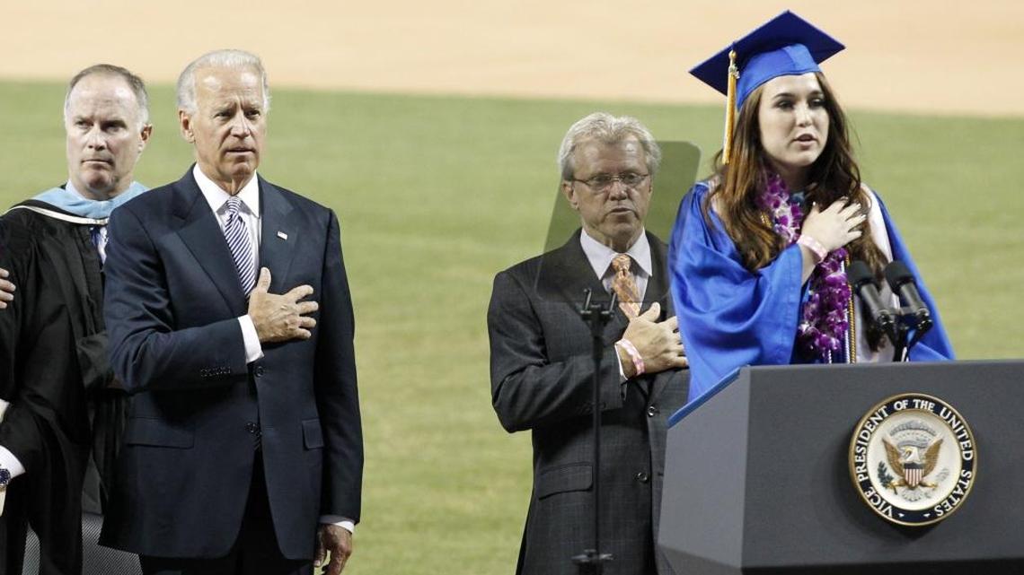 Cypress Bay student President Kayla Kervin rcites the Pledge of Allegiance as Vice President Joe Biden stands in the background. Biden delivered the commencement address to the Cypress Bay High School graduates at Marlins Park in Miami, June 4, 2012.