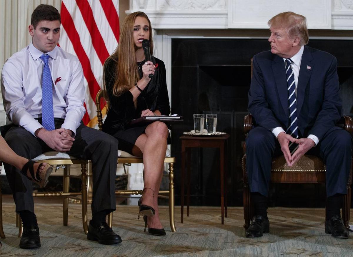 President Donald Trump, who participated in a listening session with high school students Wednesday, including Jonathan Blank, left, and Julia Cordover of Marjory Stoneman Douglas High School, has called for trained teachers or others in schools to carry guns as a deterrent to attacks.