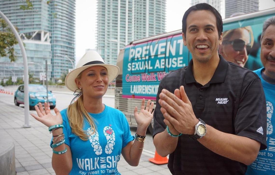 Miami Heat Coach Erik Spoelstra, right, joins Lauren Book for a mile walk around AmericanAirlines Arena, March 22, 2013, as part of the annual 1,500-mile walk through Florida.