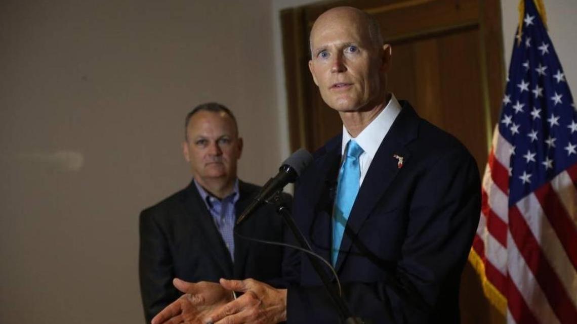 Gov. Rick Scott and House Speaker Richard Corcoran at a press conference at Miami International Airport to announce a special session on budget and economic development programs.