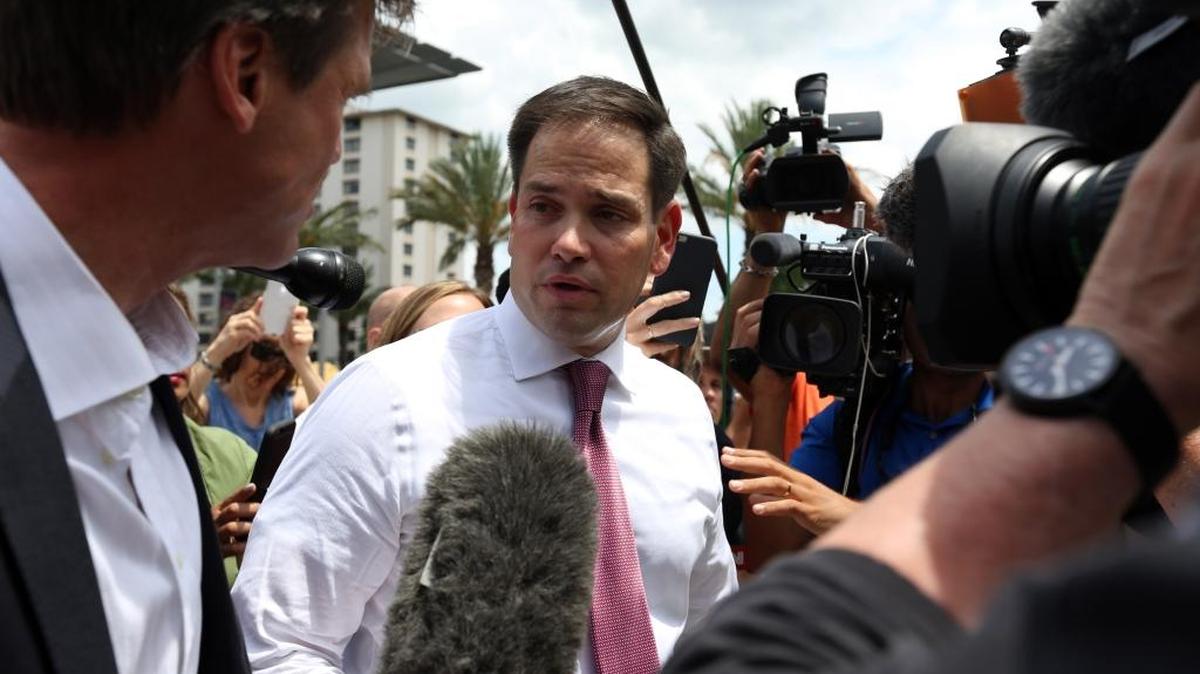 Florida Sen. Marco Rubio answers questions from the press after paying his respects to the victims of the Pulse nightclub shooting at Dr. Phillips Center for the Performing Arts in Orlando on Thursday, June 16, 2016.