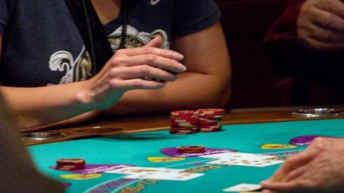 Lisa Johnson of Bel Air, Maryland, watches the dealer deal a hand in blackjack at the Seminole Hard Rock Casino in Hollywood in 2011.