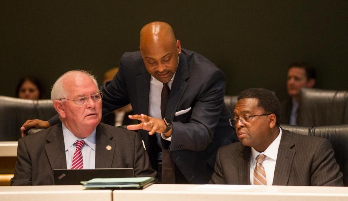 Democrat Florida Senators, from left, Bill Montford, Oscar Braynon and Perry E. Thurston confer in the Senate Rules Committee meeting on gun safety Monday.